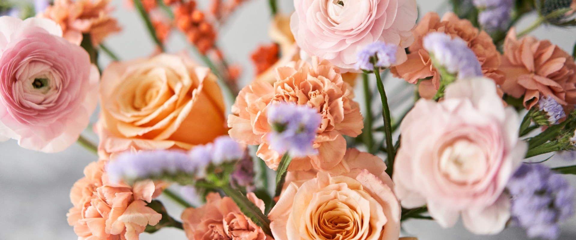 Finished flower arrangement in a vase for home. Flowers bunch, set for interior. Fresh cut flowers for decoration home. European floral shop. Delivery fresh cut flower.